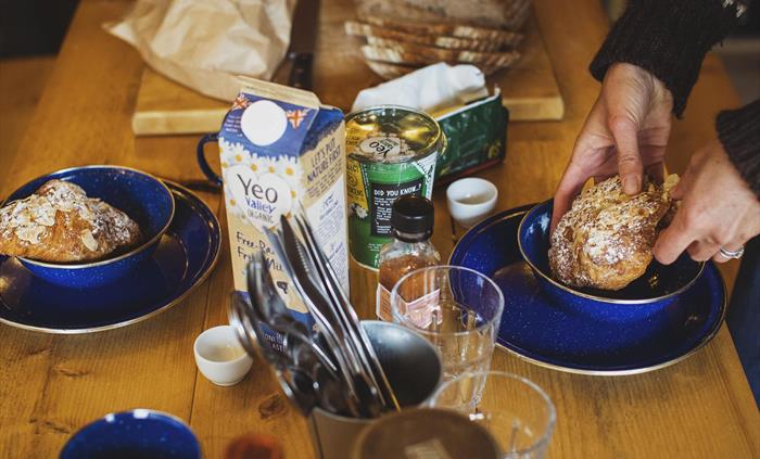 A close up of a dining table set for breakfast